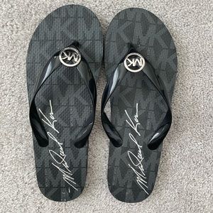 Never worn Michael Kors flip flops